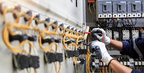 Professional Electrician technician working in Roland, AR